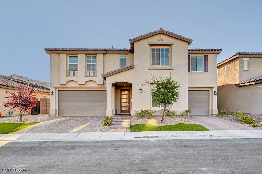 4709 Amazing View Street, Las Vegas, NV 89129 Spanish tile roofing and stucco exterior walls create classic curb appeal for this two-story home.