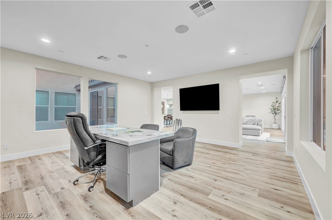 4709 Amazing View Street, Las Vegas, NV 89129 Gleaming hardwood floors and recessed lighting enhance this versatile home workspace.