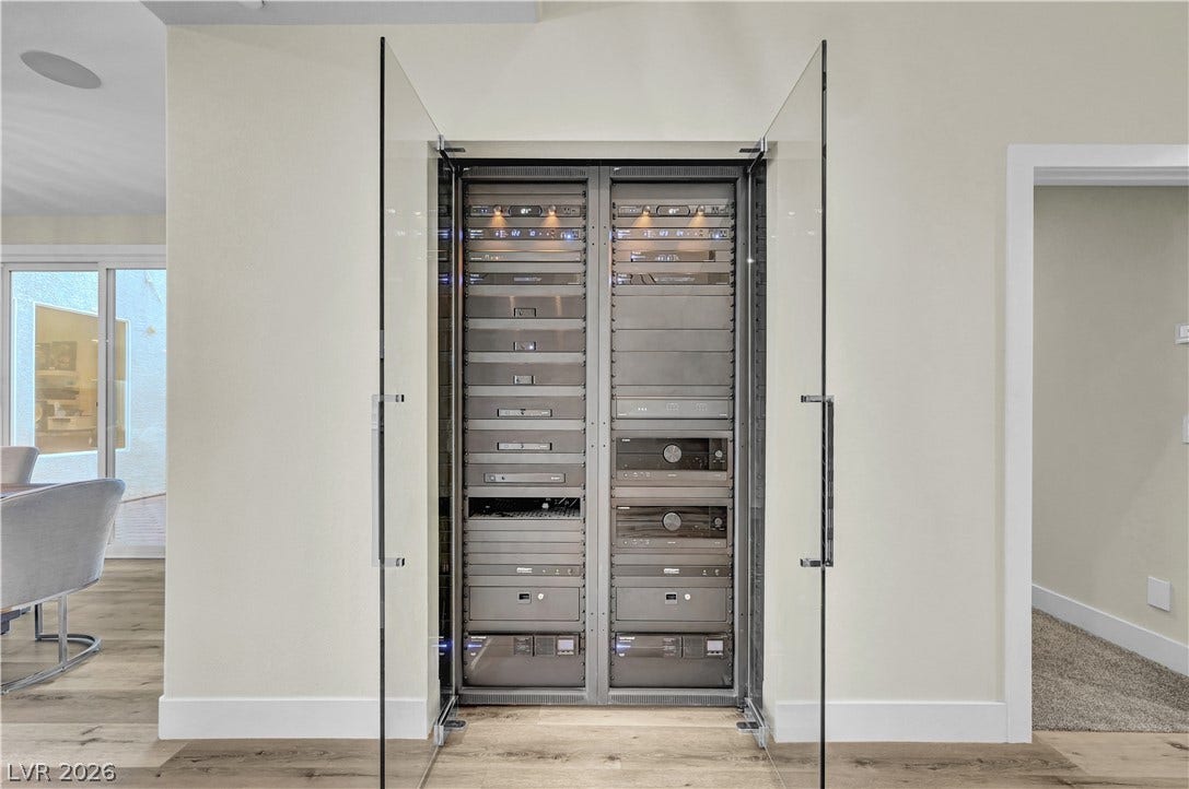 4709 Amazing View Street, Las Vegas, NV 89129 A dedicated home automation and media server rack stands integrated behind custom glass doors.