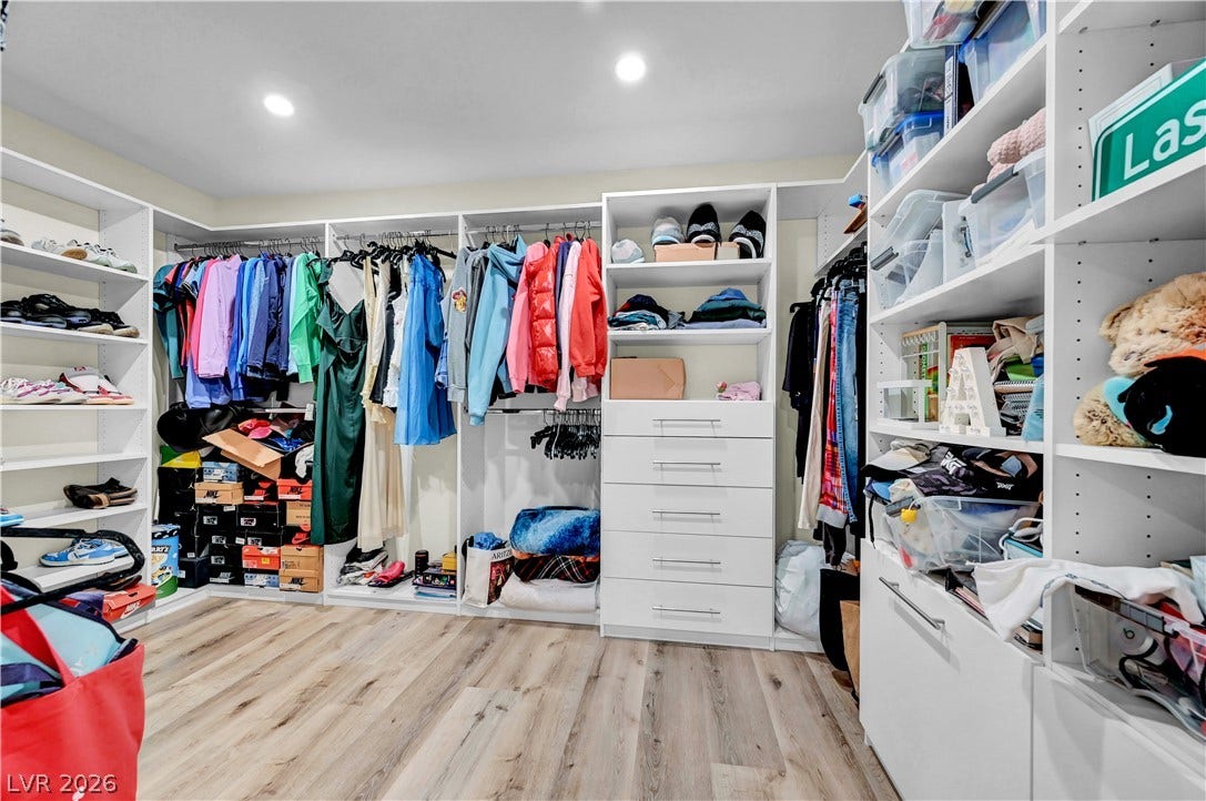 4709 Amazing View Street, Las Vegas, NV 89129 Abundant built-in shelving and custom drawers maximize organization in this spacious dressing area.