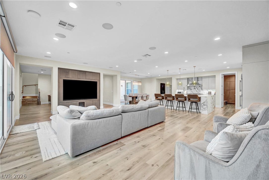 4709 Amazing View Street, Las Vegas, NV 89129 An open concept floorplan features expansive wood floors and integrated recessed lighting throughout.