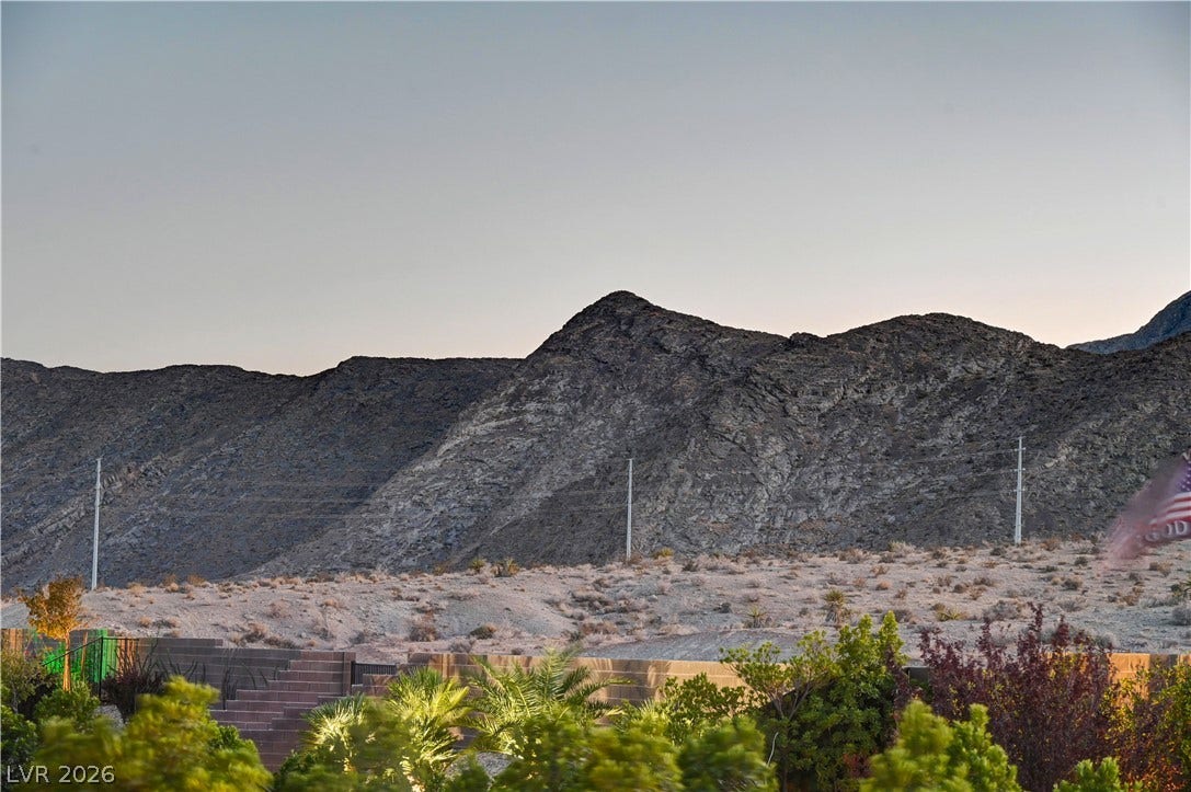 4709 Amazing View Street, Las Vegas, NV 89129 Rugged ridges rise under a soft sky, creating a dramatic backdrop for the property.