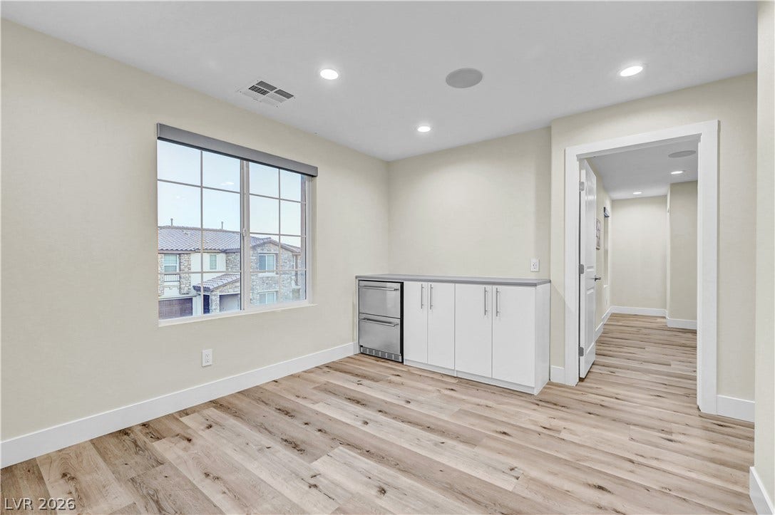 4709 Amazing View Street, Las Vegas, NV 89129 Smooth wood floors anchor this versatile bonus room complete with a built-in wet bar.