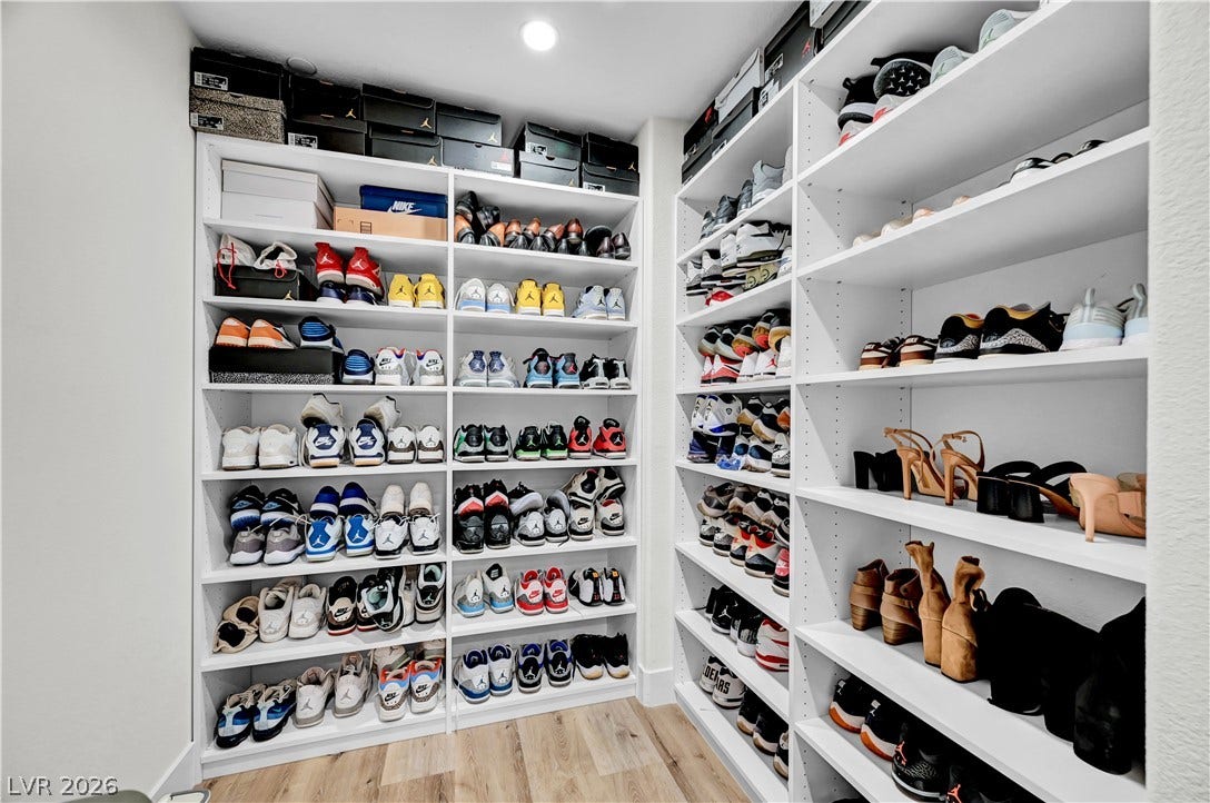 4709 Amazing View Street, Las Vegas, NV 89129 Floor-to-ceiling custom shelving offers abundant organization inside this walk-in closet with warm wood flooring.