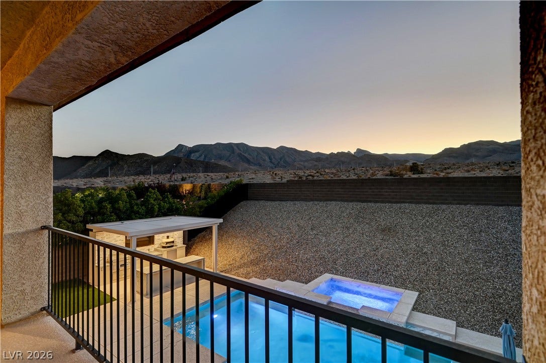 4709 Amazing View Street, Las Vegas, NV 89129 Dramatic mountain vistas frame this backyard oasis complete with a pool and built-in barbecue.