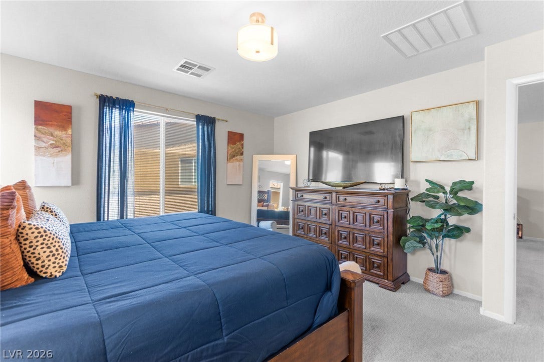 7224 Halo Falls Street, North Las Vegas, NV 89084 Plush carpeting and well-lit interiors define this cozy, inviting sleeping sanctuary.