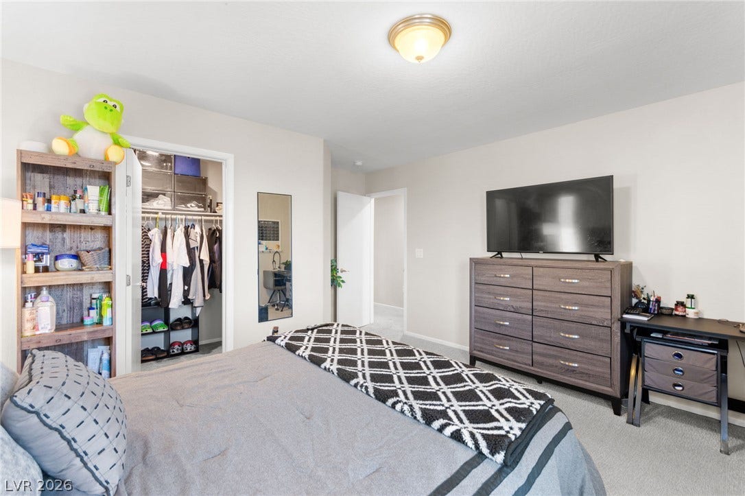 7224 Halo Falls Street, North Las Vegas, NV 89084 This cozy bedroom features a convenient walk-in closet for ample storage.