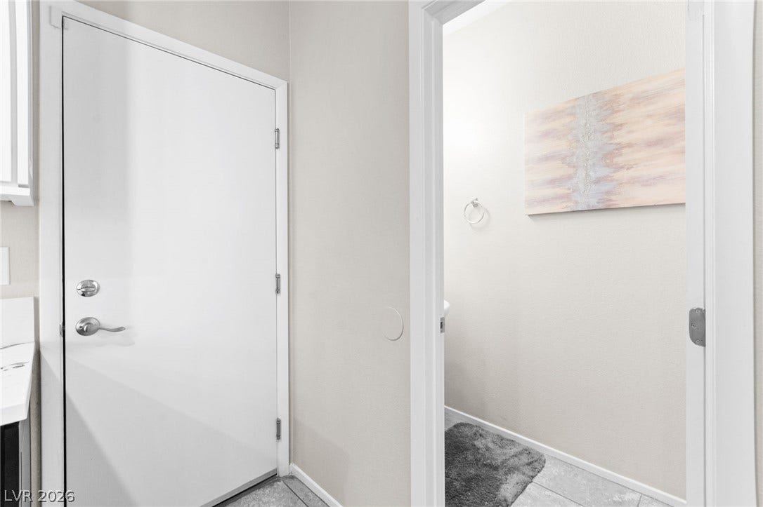 7224 Halo Falls Street, North Las Vegas, NV 89084 Bright interior features crisp walls and durable tile flooring throughout.