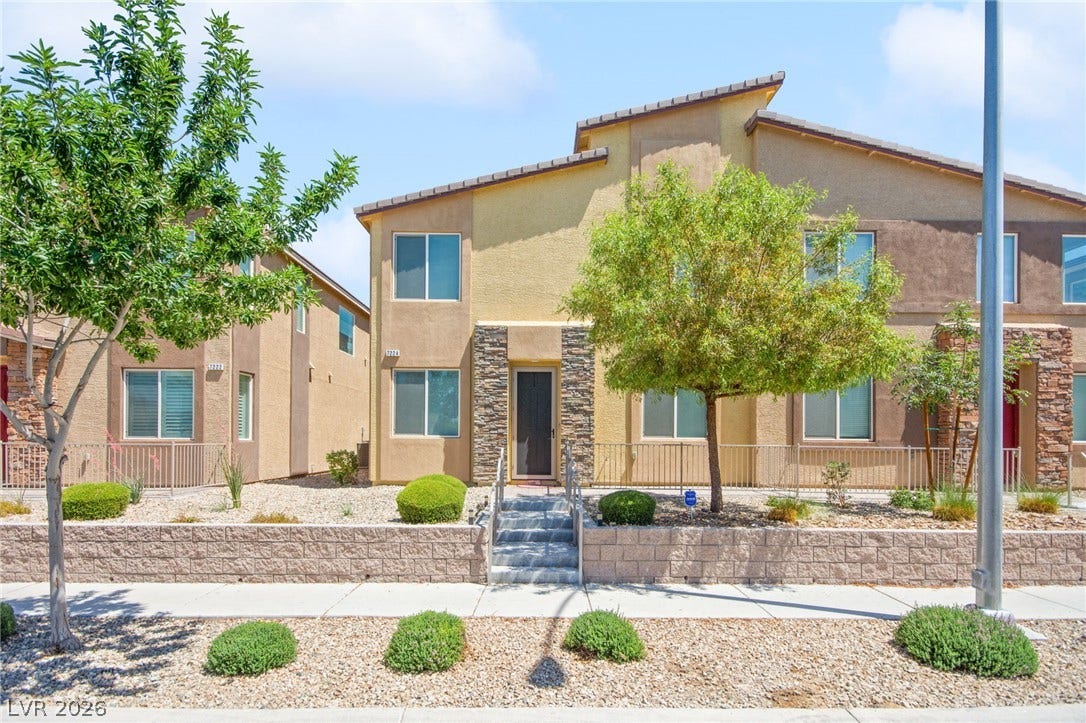 7224 Halo Falls Street, North Las Vegas, NV 89084 A contemporary desert oasis featuring a striking stone facade and meticulously landscaped drought-tolerant plants.