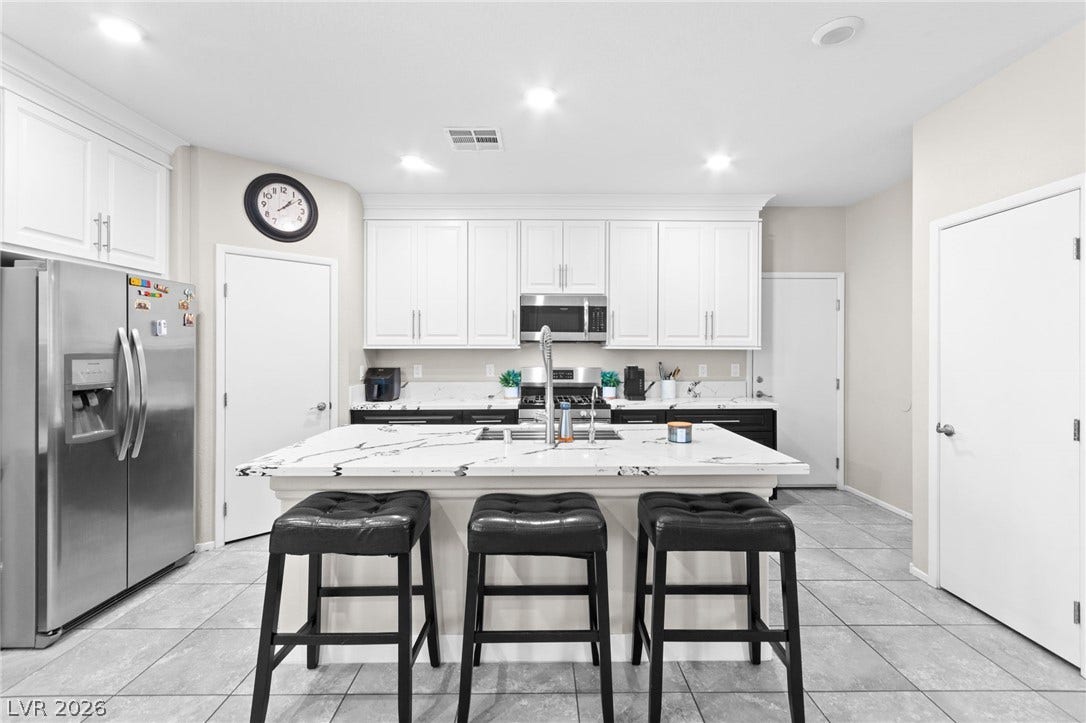 7224 Halo Falls Street, North Las Vegas, NV 89084 A well-appointed kitchen showcasing contemporary design and a functional layout.