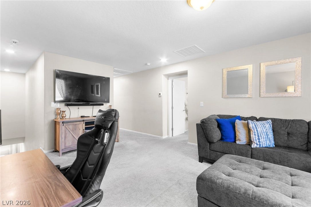 7224 Halo Falls Street, North Las Vegas, NV 89084 A versatile bonus room offers ample space for a media center and comfortable seating area.