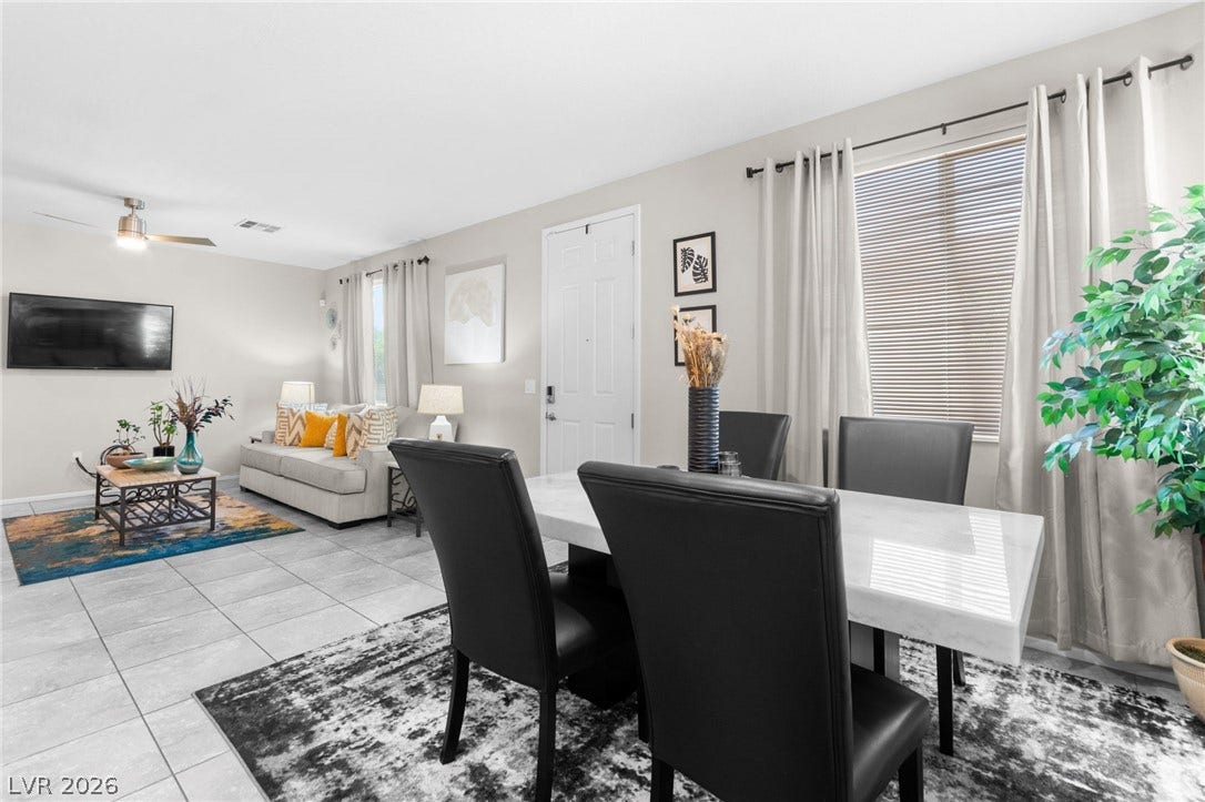 7224 Halo Falls Street, North Las Vegas, NV 89084 Functional layout connecting the dining area to a comfortable living space with a modern aesthetic.