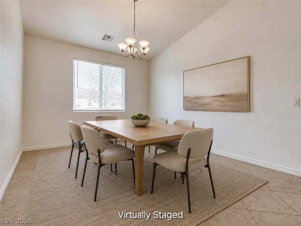 4709 Estate Ranch Street, North Las Vegas, NV 89031 An inviting dining area features vaulted ceilings, tile flooring, and a window with natural light.