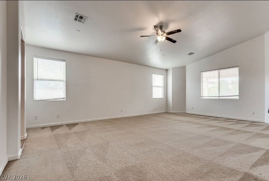 4709 Estate Ranch Street, North Las Vegas, NV 89031 A spacious upper-level area offers multiple windows and a central ceiling fan.