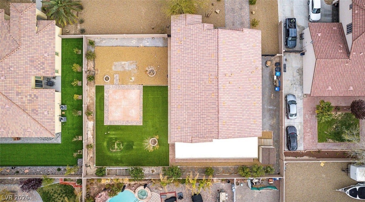 4709 Estate Ranch Street, North Las Vegas, NV 89031 Overhead view reveals lush green lawns, patio spaces, and potential for outdoor enjoyment.