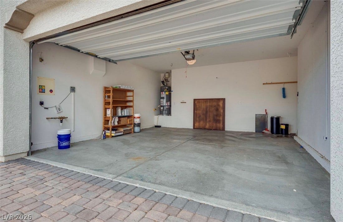 4709 Estate Ranch Street, North Las Vegas, NV 89031 Ample garage space for vehicles and storage with direct outdoor access.