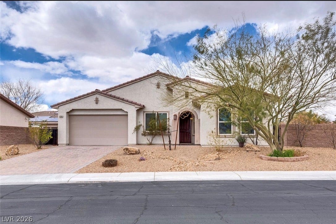 4709 Estate Ranch Street, North Las Vegas, NV 89031 A desert-friendly landscape surrounds this charming stucco home with a two-car garage and inviting arched entry.