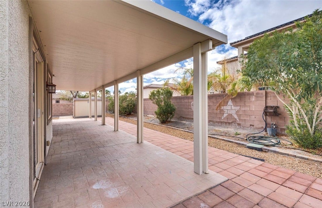 4709 Estate Ranch Street, North Las Vegas, NV 89031 An inviting covered patio offers ample space for outdoor enjoyment and relaxation.
