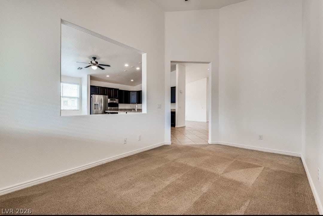 4709 Estate Ranch Street, North Las Vegas, NV 89031 A versatile open-plan area offers seamless connectivity to the adjacent kitchen and other rooms.