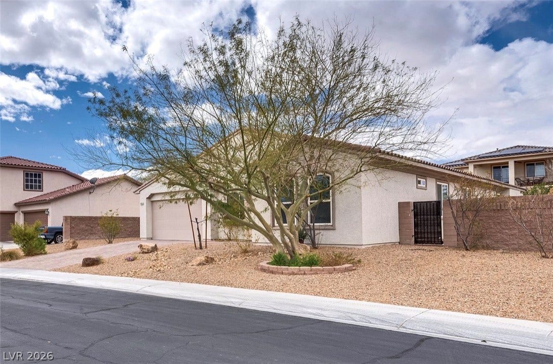 4709 Estate Ranch Street, North Las Vegas, NV 89031 A well-maintained desert landscape frames this welcoming single-story home.