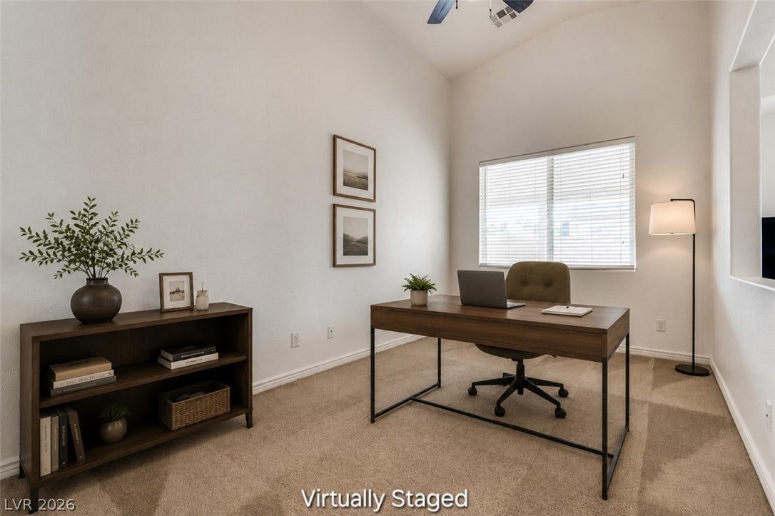 4709 Estate Ranch Street, North Las Vegas, NV 89031 A quiet office space features high ceilings and soft carpeting, perfect for productive work.