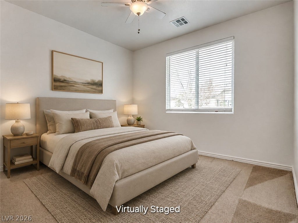 4709 Estate Ranch Street, North Las Vegas, NV 89031 A tranquil bedroom retreat features soft carpeting and a window with natural light.