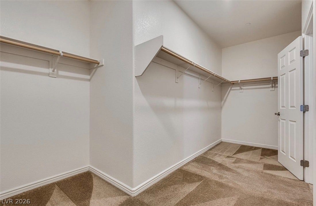 4709 Estate Ranch Street, North Las Vegas, NV 89031 A spacious walk-in closet with ample shelving and hanging rods for organized storage.