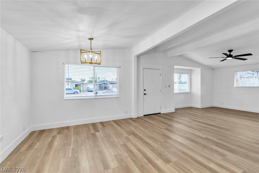 1604 Basswood Avenue, North Las Vegas, NV 89030 Clean lines and warm wood-style flooring define this open, airy main living space.