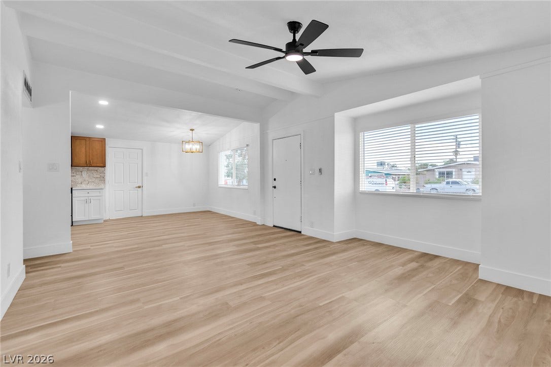 1604 Basswood Avenue, North Las Vegas, NV 89030 Clean lines and smooth flooring define this light-filled, open-concept living area.