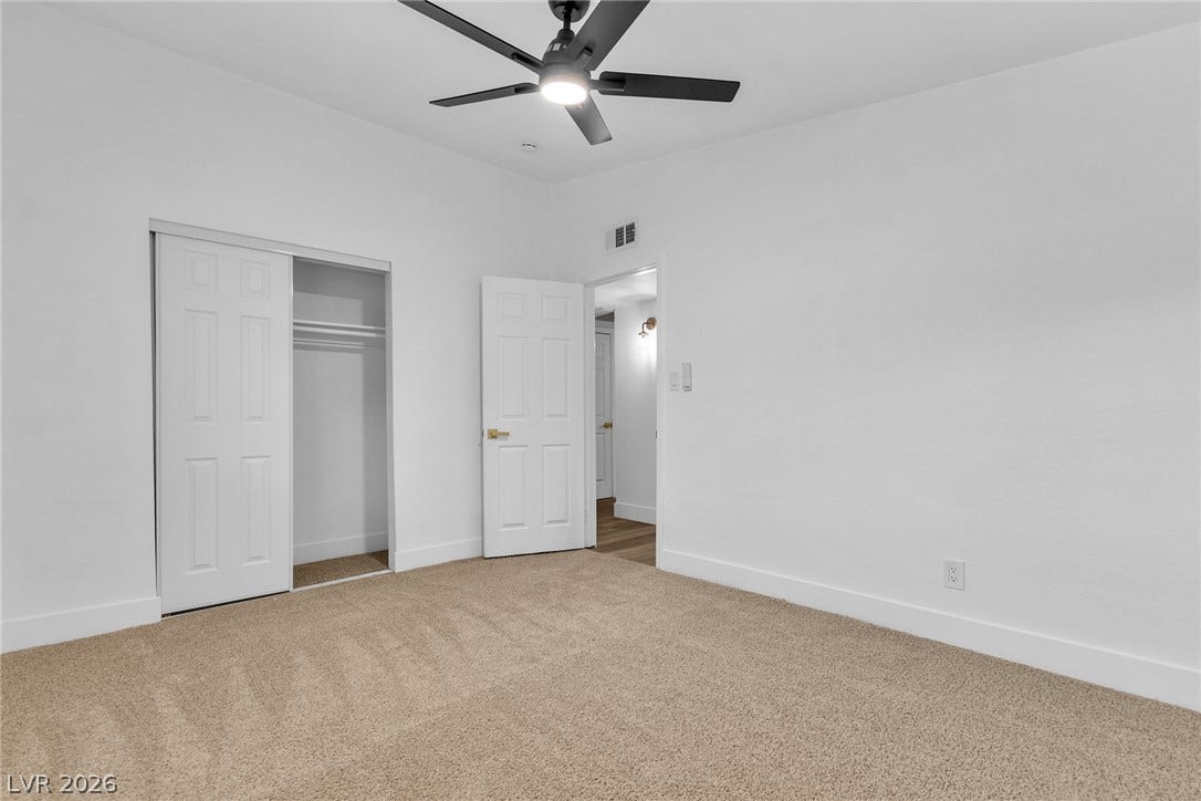 1604 Basswood Avenue, North Las Vegas, NV 89030 Soft carpeting underfoot defines this comfortable bedroom complete with a built-in closet.