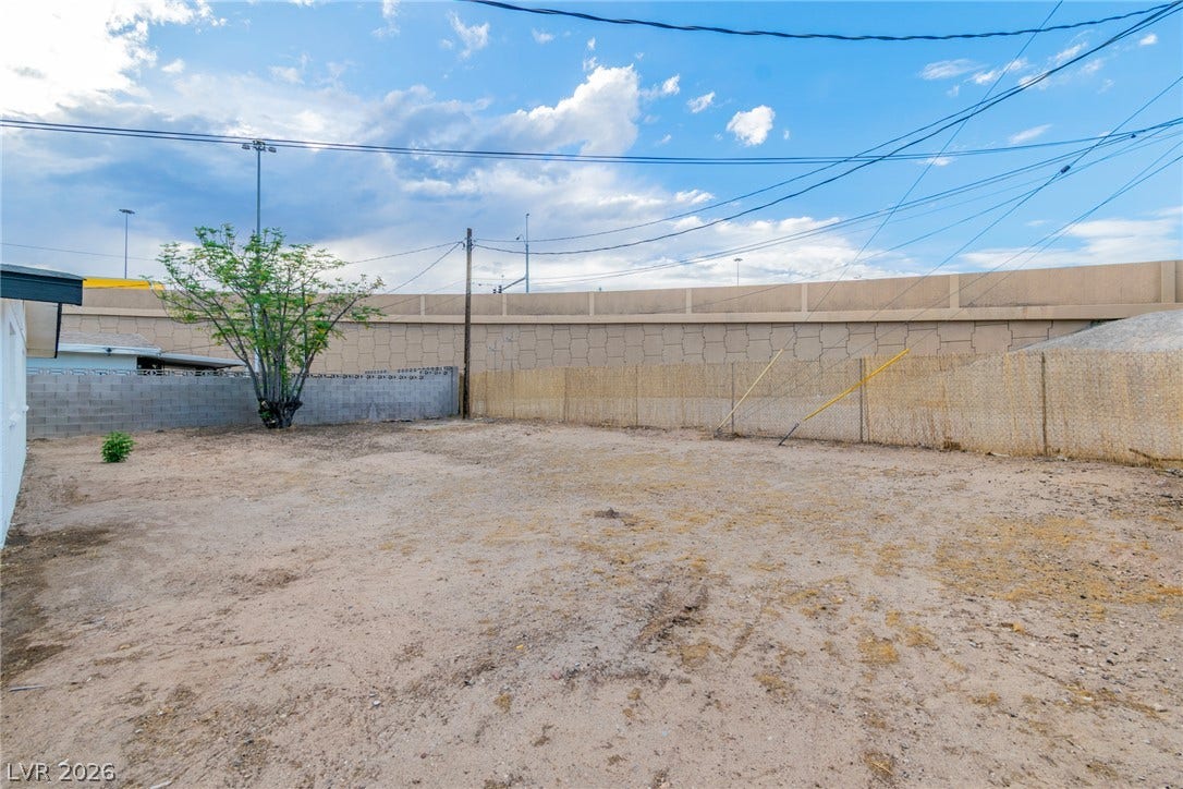 1604 Basswood Avenue, North Las Vegas, NV 89030 An expansive fenced backyard area stands ready for customized landscaping and outdoor design.