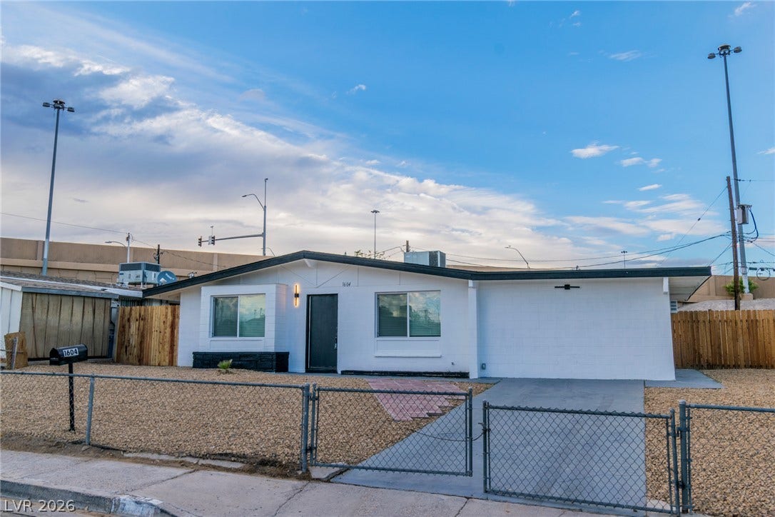 1604 Basswood Avenue, North Las Vegas, NV 89030 Clean lines and classic stucco define this single-level home behind a secure chain-link fence.