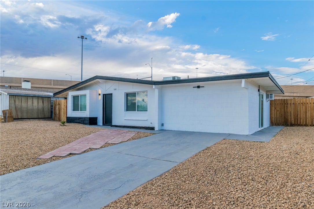 1604 Basswood Avenue, North Las Vegas, NV 89030 Clean lines and low-maintenance desert landscaping define the exterior of this modern single-story residence.