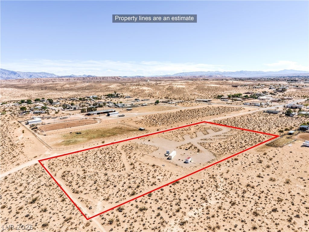 Skyline, Logandale, NV 89021 An aerial perspective showcases the sweeping desert lot framed by distant mountain ranges.