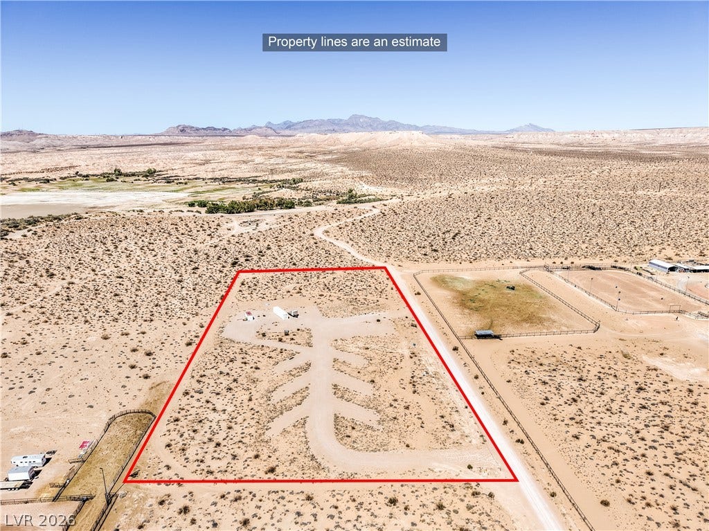 Skyline, Logandale, NV 89021 Expansive desert vistas stretch toward majestic mountain ranges under a clear blue sky.