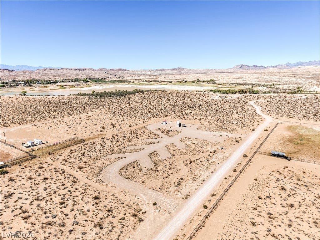 Skyline, Logandale, NV 89021 Vast desert acreage offers expansive views of distant mountains under a clear blue sky.