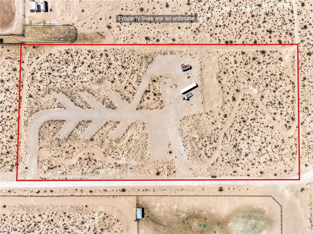 Skyline, Logandale, NV 89021 An aerial perspective showcases a vast desert lot outlined with approximate boundaries.