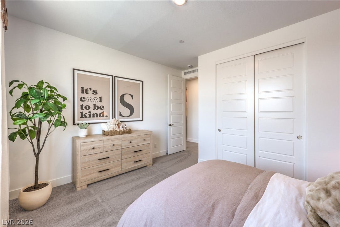 844 Kassie Lake Way, North Las Vegas, NV 89084 Plush carpeting and integrated closet space anchor this inviting bedroom. Representational only; Photo is of the 2660 Plan Model Home - NOT THE ACTUAL HOME FOR SALE *material/features/colors can vary from one community to the next & are subject to change*