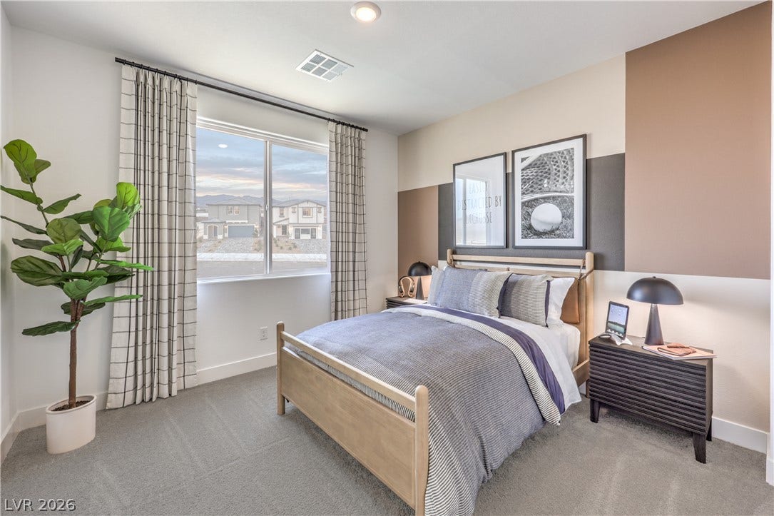 844 Kassie Lake Way, North Las Vegas, NV 89084 A spacious window brings natural light and neighborhood views into this cozy carpeted bedroom. Representational only; Photo is of the 2660 Plan Model Home - NOT THE ACTUAL HOME FOR SALE *material/features/colors can vary from one community to the next & are subject to change*