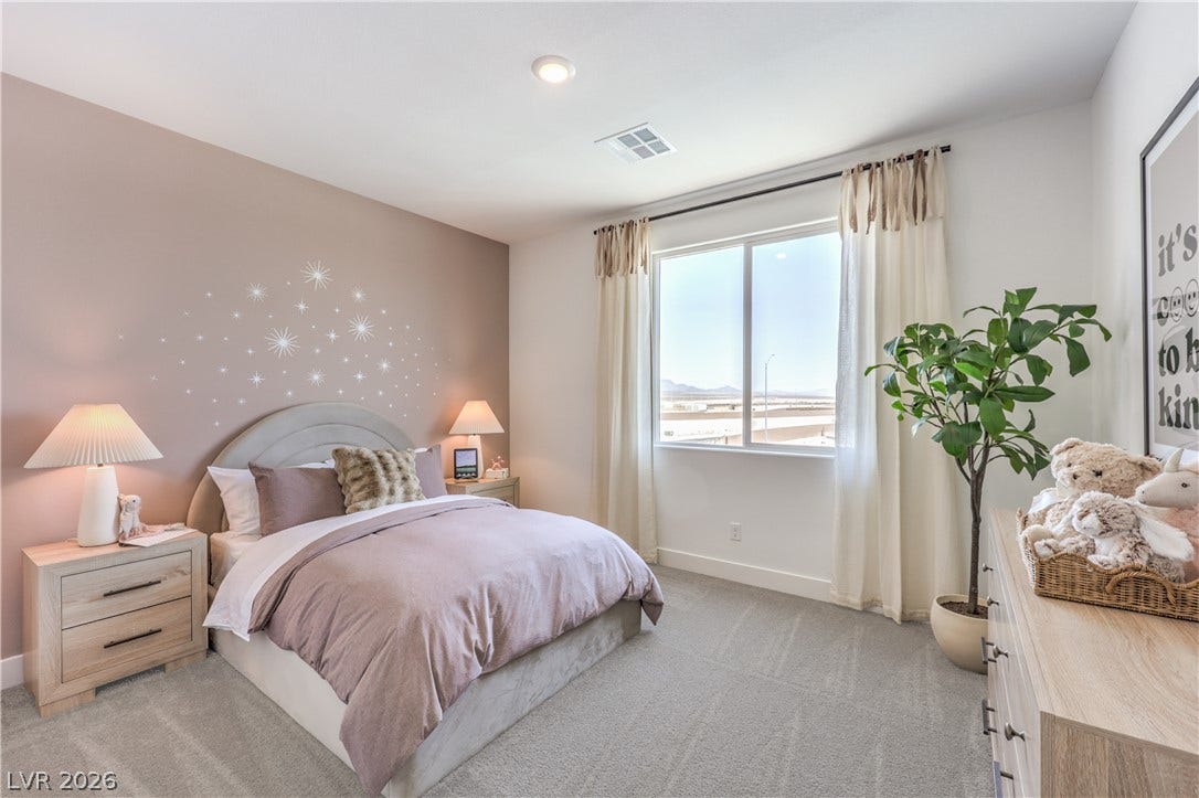 844 Kassie Lake Way, North Las Vegas, NV 89084 Plush carpeting and a large window framing desert views define this peaceful bedroom. Representational only; Photo is of the 2660 Plan Model Home - NOT THE ACTUAL HOME FOR SALE *material/features/colors can vary from one community to the next & are subject to change*