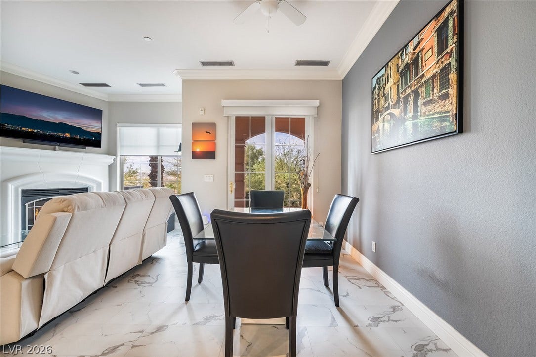 30 Via Vasari, #103, Henderson, NV 89011 Gleaming stone-look floors set an elegant tone in this open-concept dining space.