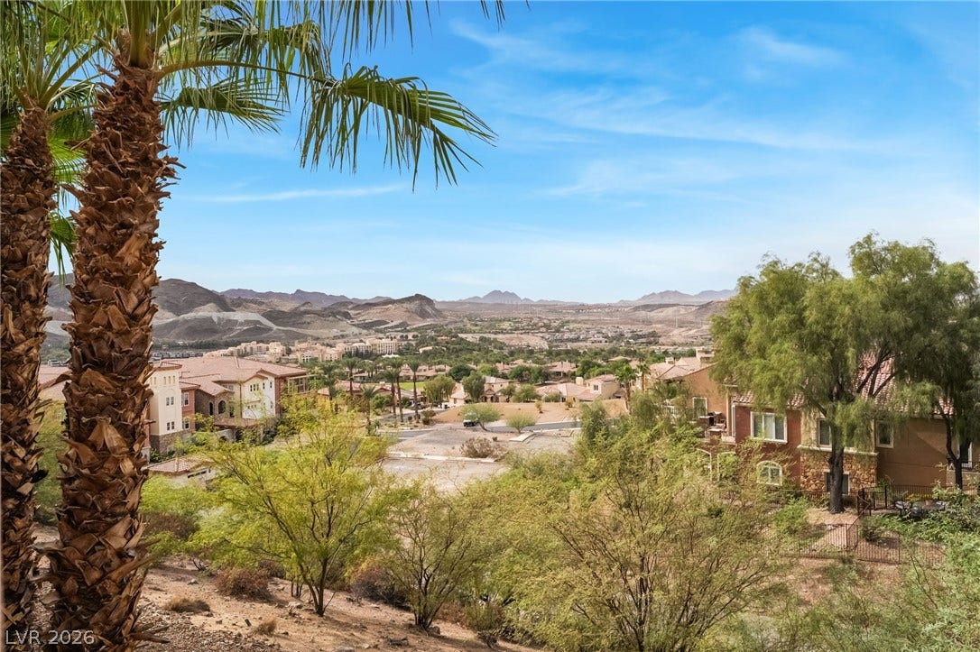 30 Via Vasari, #103, Henderson, NV 89011 Sweeping mountain and desert views frame the surrounding residential landscape.