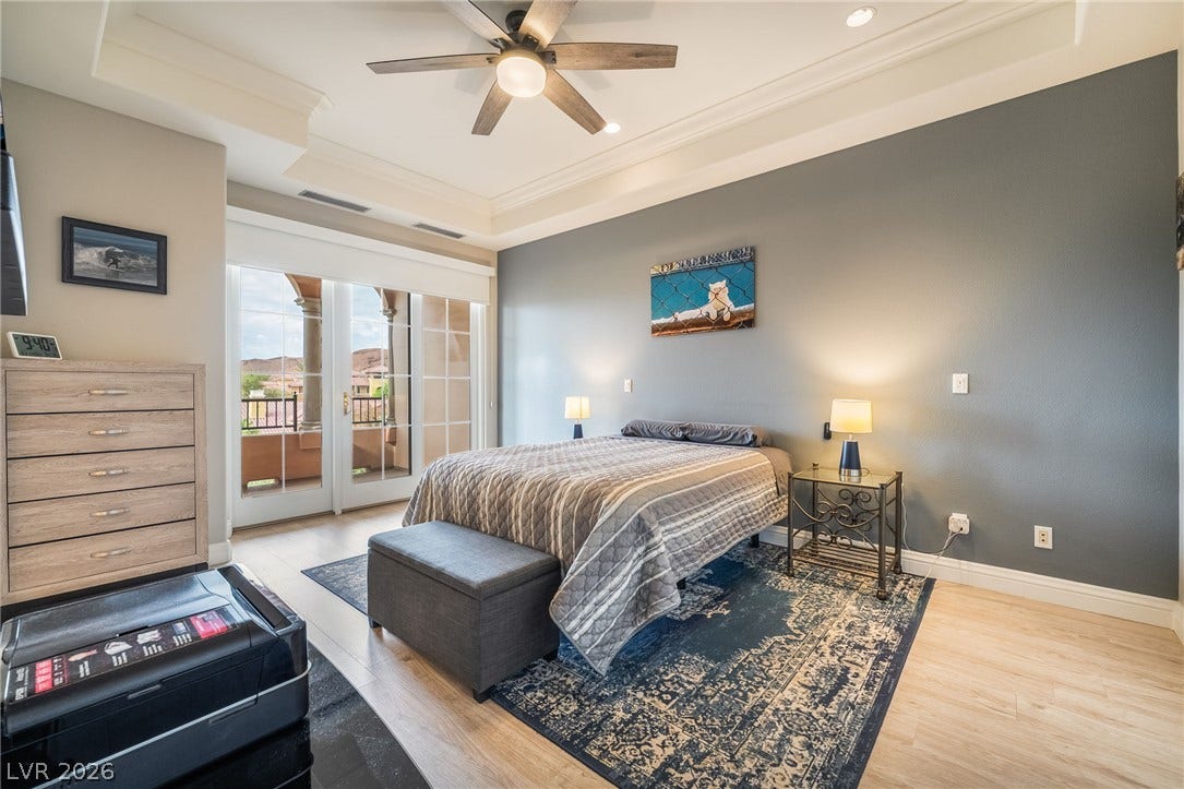 30 Via Vasari, #103, Henderson, NV 89011 Double doors open to a private balcony from this spacious bedroom with tray ceilings.