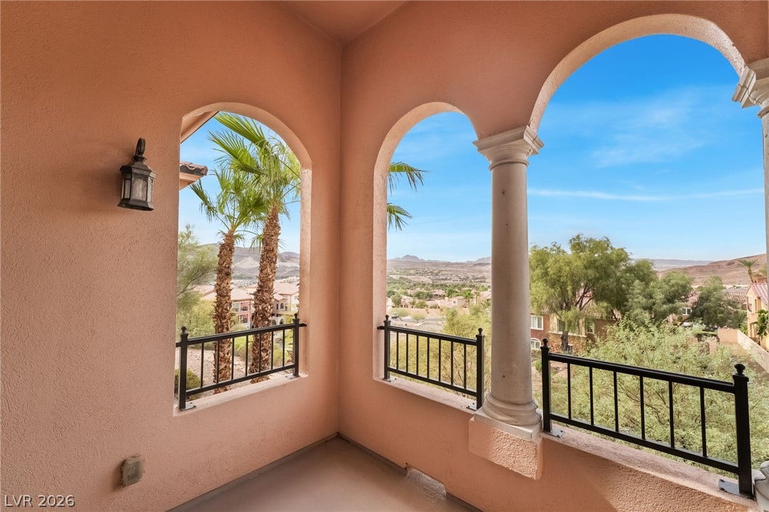 30 Via Vasari, #103, Henderson, NV 89011 Graceful arched openings frame far-reaching neighborhood and desert views from this elevated balcony.