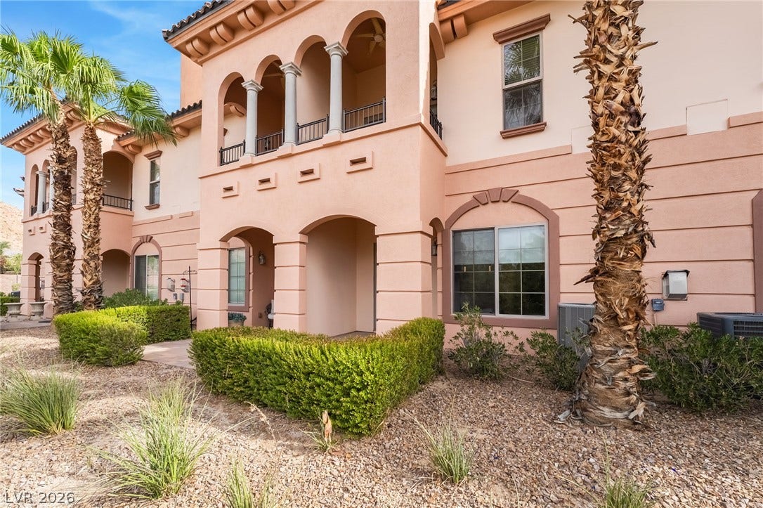 30 Via Vasari, #103, Henderson, NV 89011 Elegant arches and classic stucco columns define this beautifully detailed Mediterranean exterior.