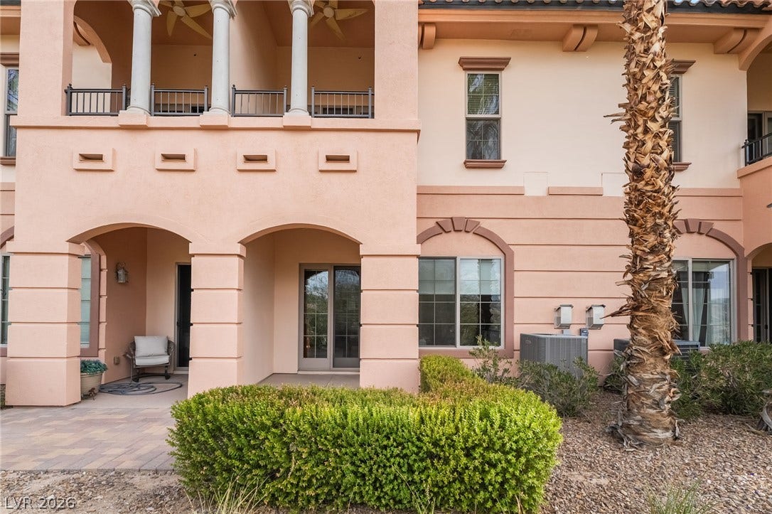 30 Via Vasari, #103, Henderson, NV 89011 Stately stucco arches and covered patios define the exterior architectural character of this property.