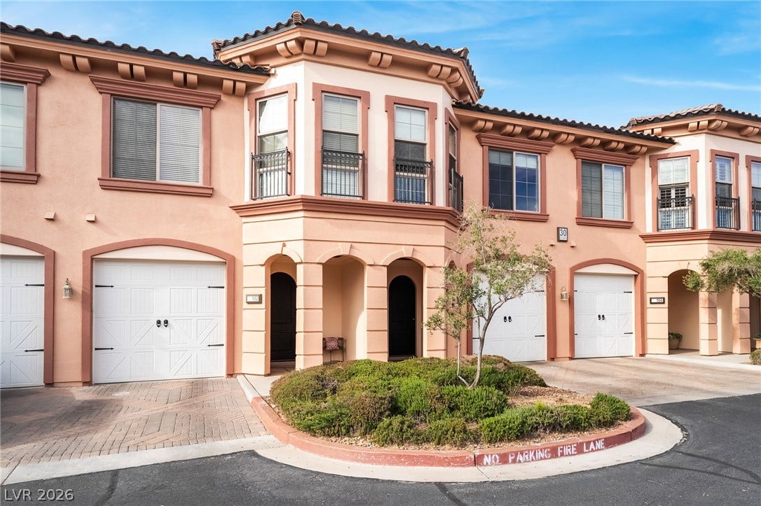 30 Via Vasari, #103, Henderson, NV 89011 Spanish tile roofs and arched entryways define this multi-level Mediterranean-inspired facade.