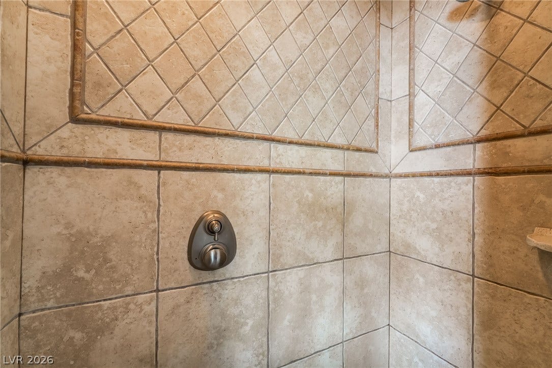 30 Via Vasari, #103, Henderson, NV 89011 Intricate tile details and custom insets elevate the design of this walk-in shower.