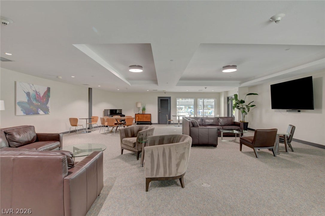 8925 W Flamingo Road, #111, Las Vegas, NV 89147 An open and versatile recreation space highlighted by recessed ceiling details and neutral wall finishes.