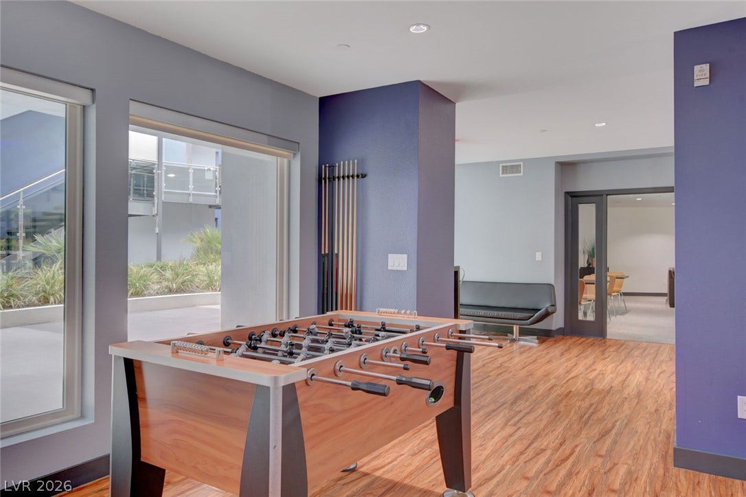 8925 W Flamingo Road, #111, Las Vegas, NV 89147 Rich wood-look flooring and clean architectural lines define this versatile recreational space.